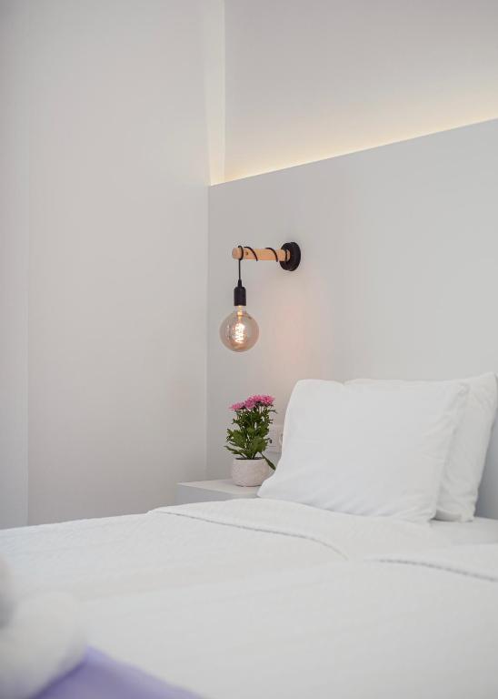 Postel nebo postele na pokoji v ubytování Venus Minimal Hotel