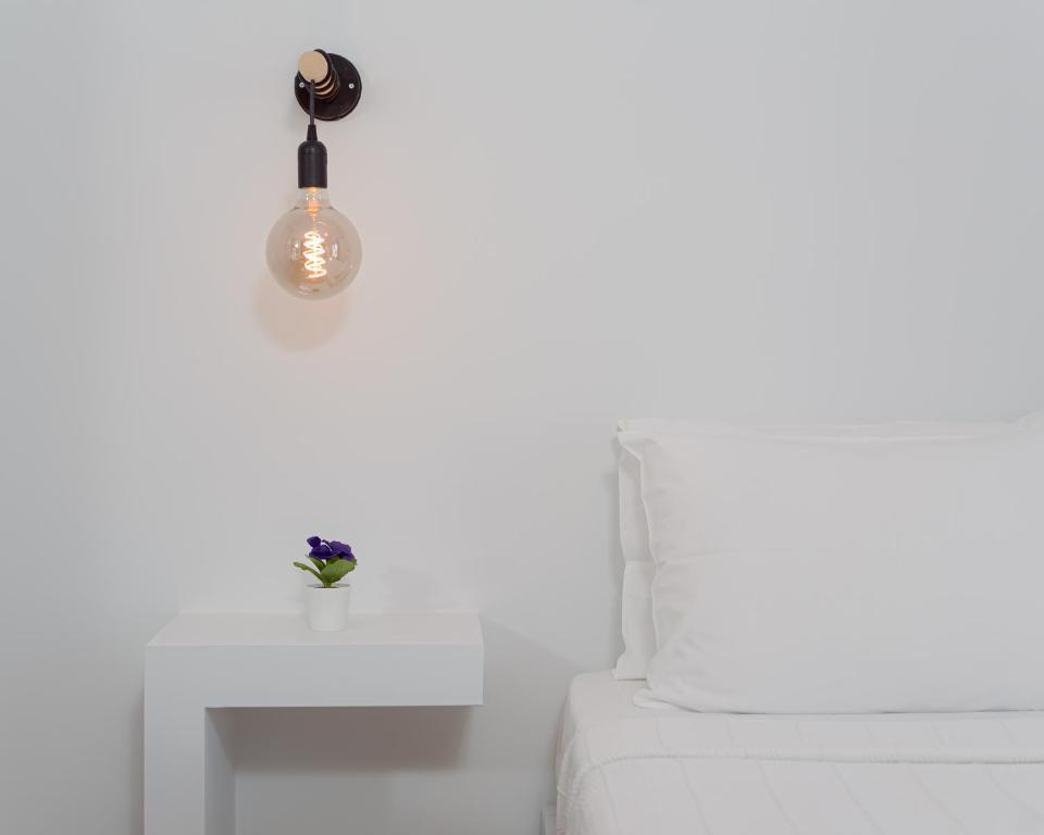 Postel nebo postele na pokoji v ubytování Venus Minimal Hotel