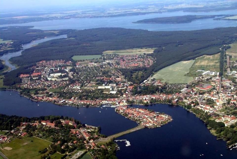 an aerial view of a city and a body of water at Katzensprung zum Wald in Malchow