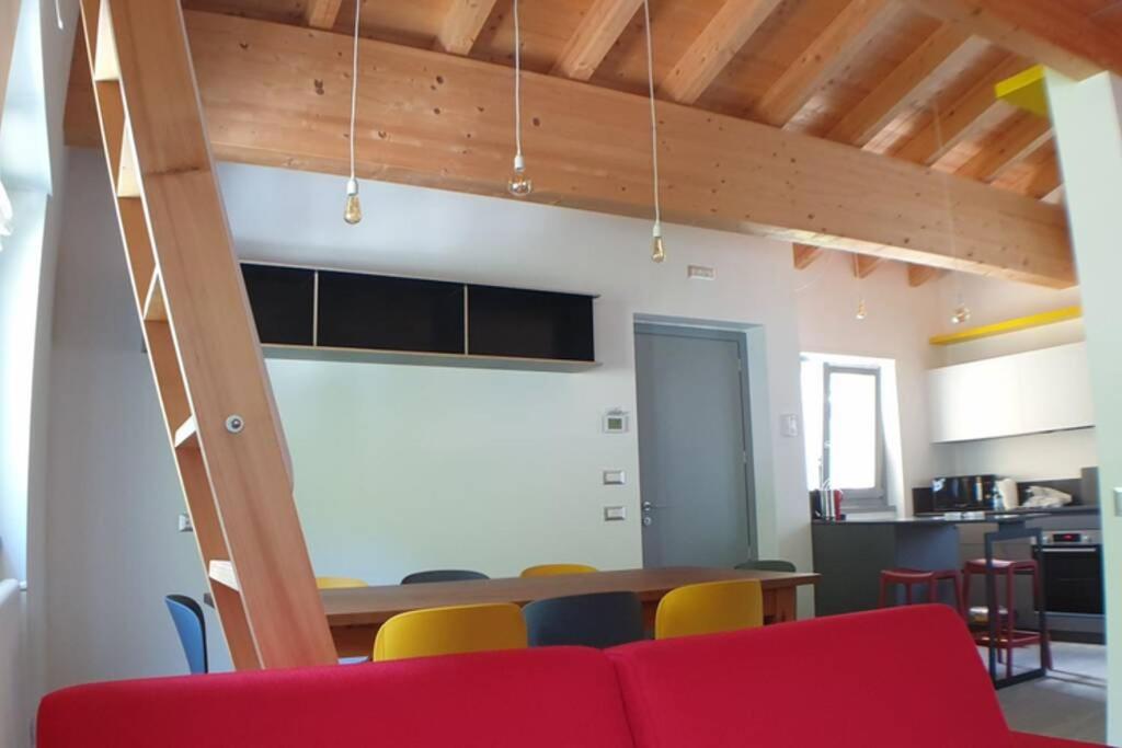 A seating area at LA FINESTRA SUL FIUME-GRAZIOSA MANSARDA.CIR 014O74