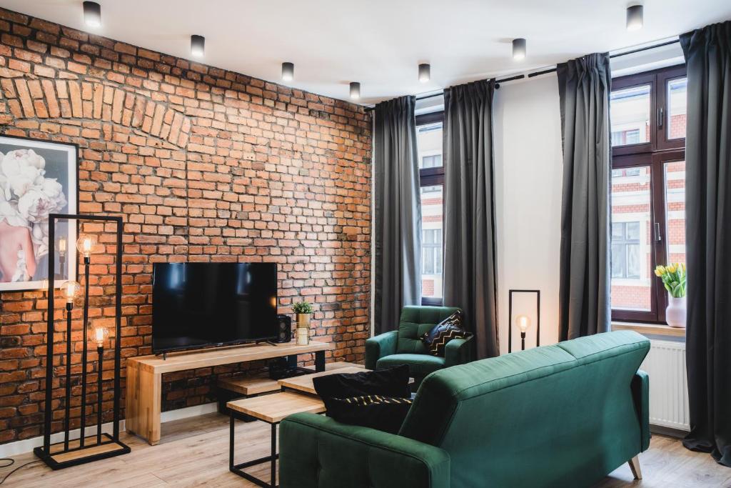 Televízia a/alebo spoločenská miestnosť v ubytovaní Modern Apartments Toruń 3 Stare Miasto-Centrum
