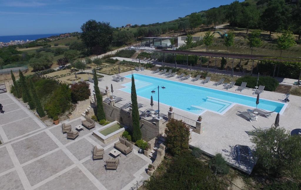 an overhead view of a swimming pool with lounge chairs at Villa Sant'Angelo in Alba Adriatica