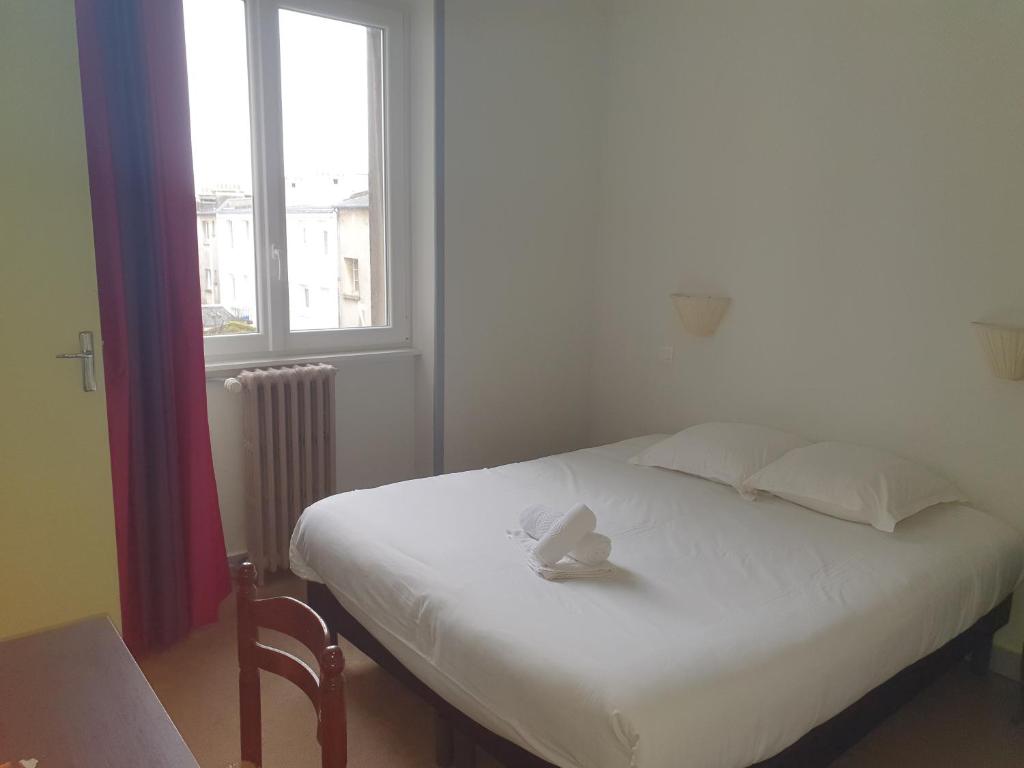 Postel nebo postele na pokoji v ubytování Hotel Kelig