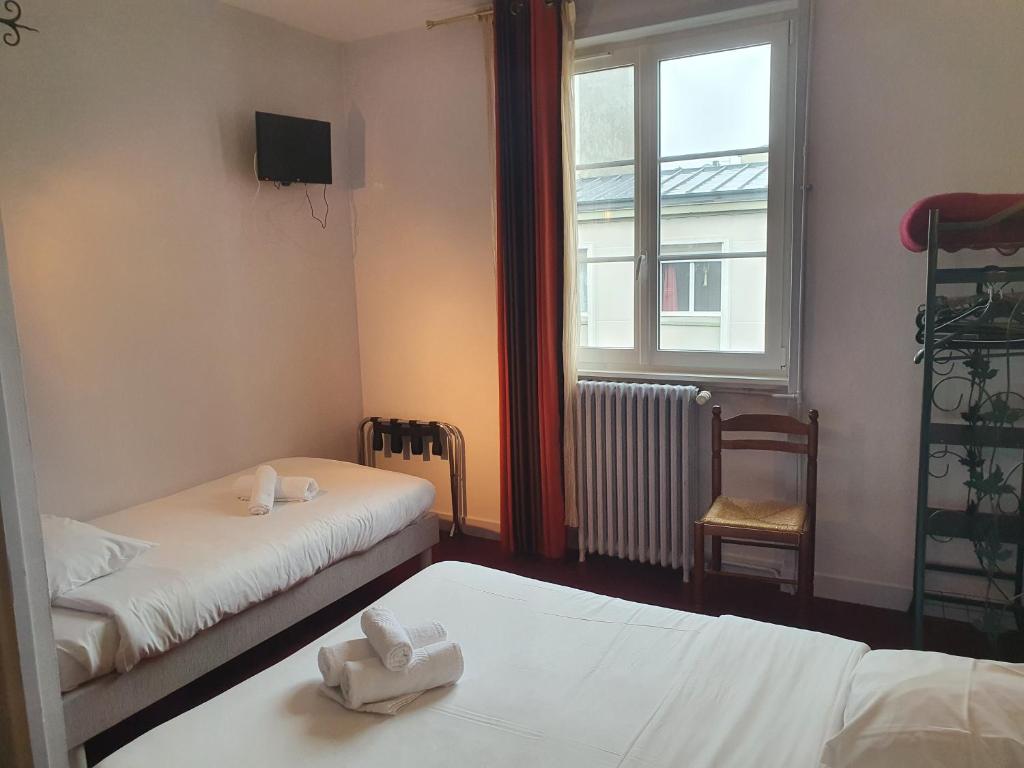 Postel nebo postele na pokoji v ubytování Hotel Kelig
