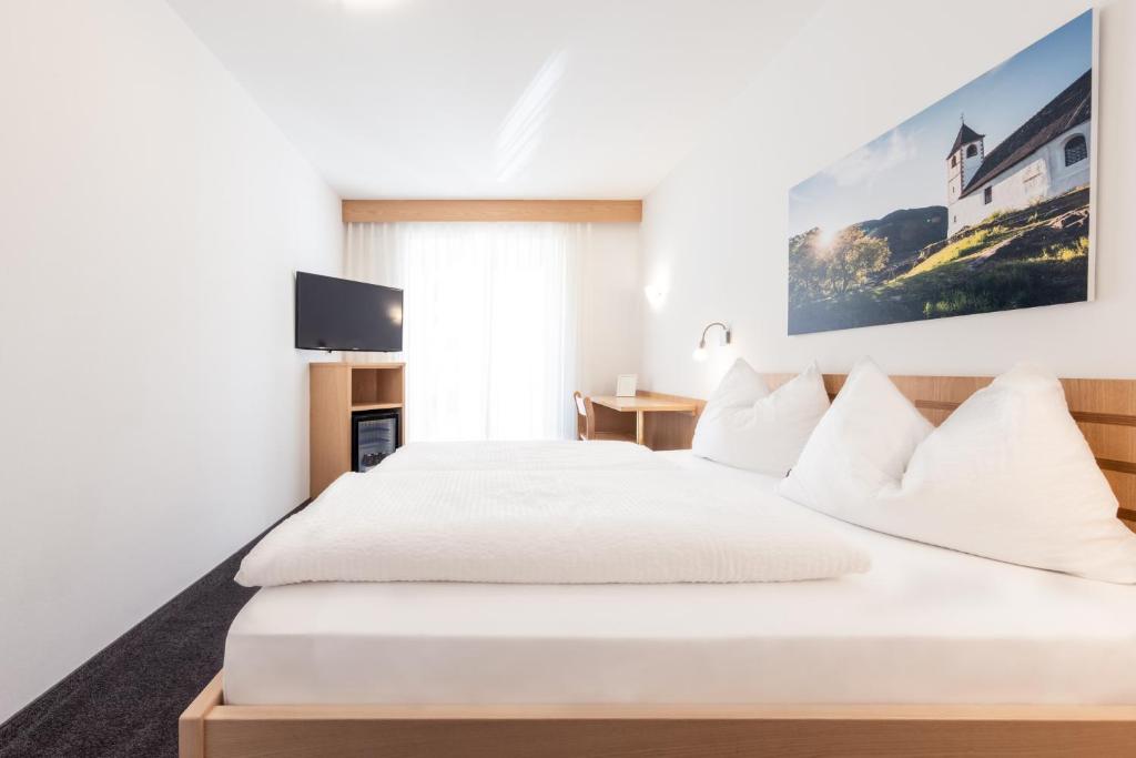 Postel nebo postele na pokoji v ubytování Mondschein Rooms