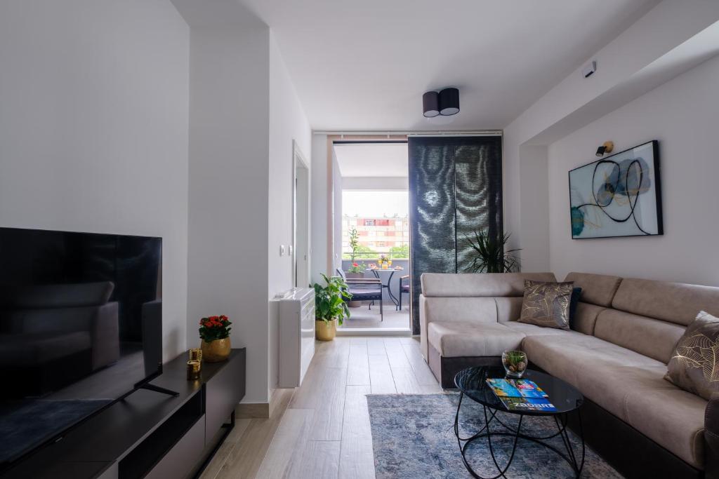 Televízia a/alebo spoločenská miestnosť v ubytovaní MB Luxury Apartments