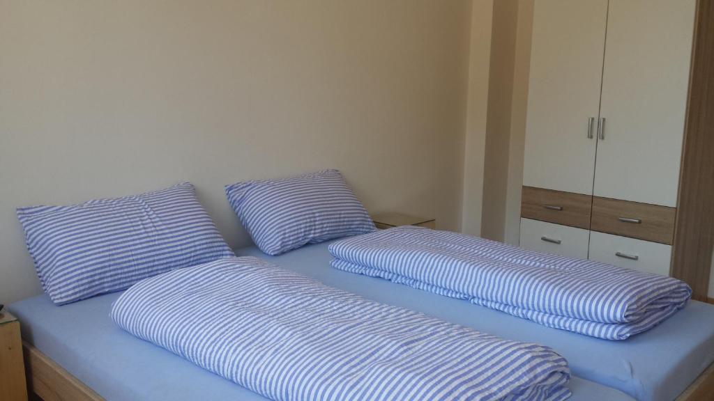 Łóżko lub łóżka w pokoju w obiekcie Argentieri Guesthouse