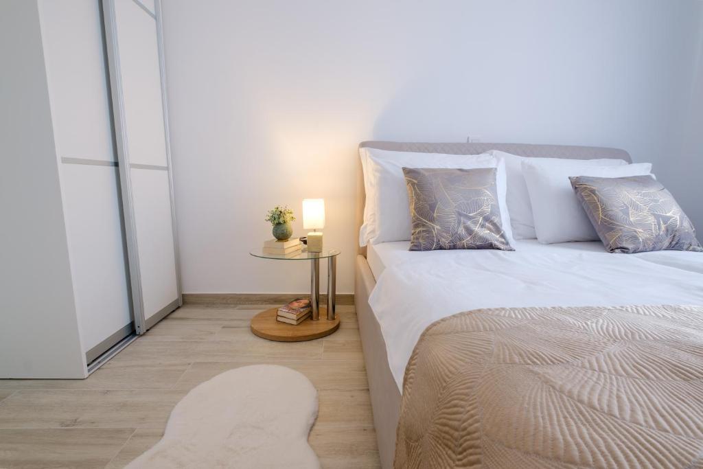 Posteľ alebo postele v izbe v ubytovaní MB Luxury Apartments