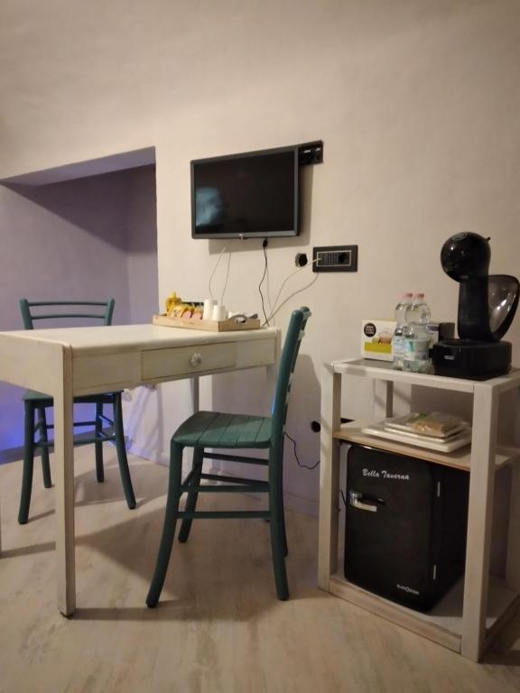 Televízia a/alebo spoločenská miestnosť v ubytovaní Casa Roberta