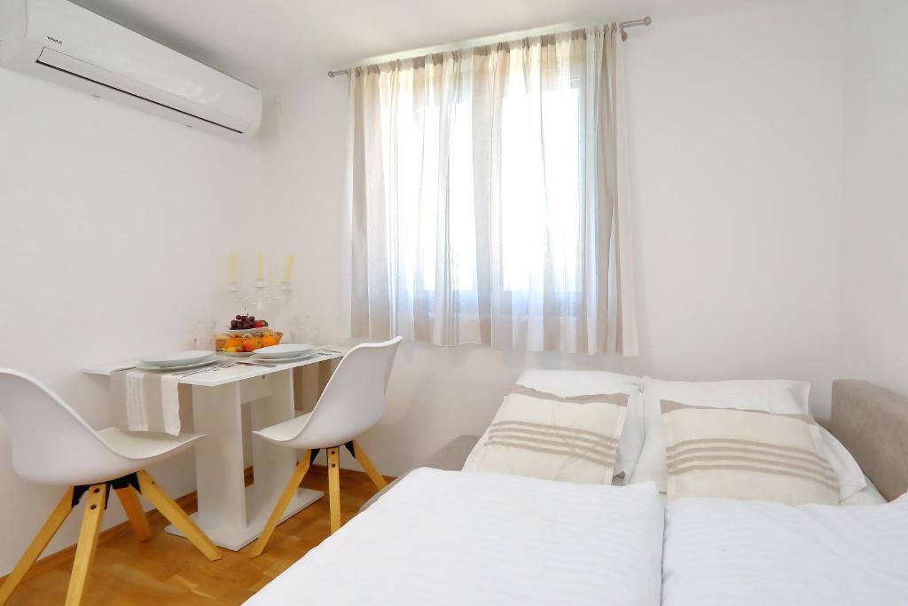 Postel nebo postele na pokoji v ubytování Villa Topesa 1
