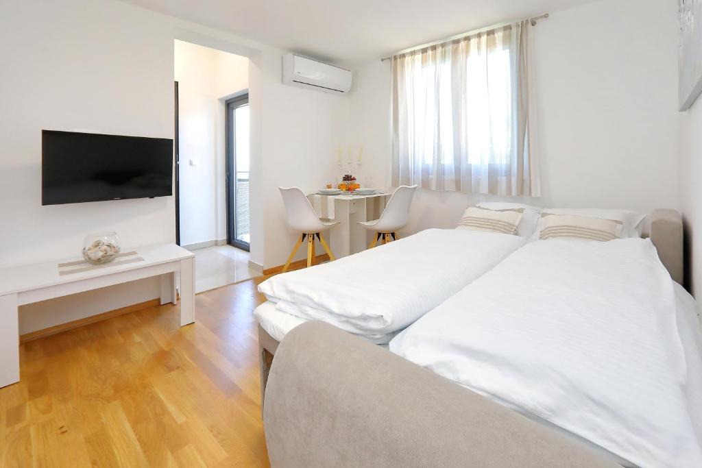 Postel nebo postele na pokoji v ubytování Villa Topesa 1
