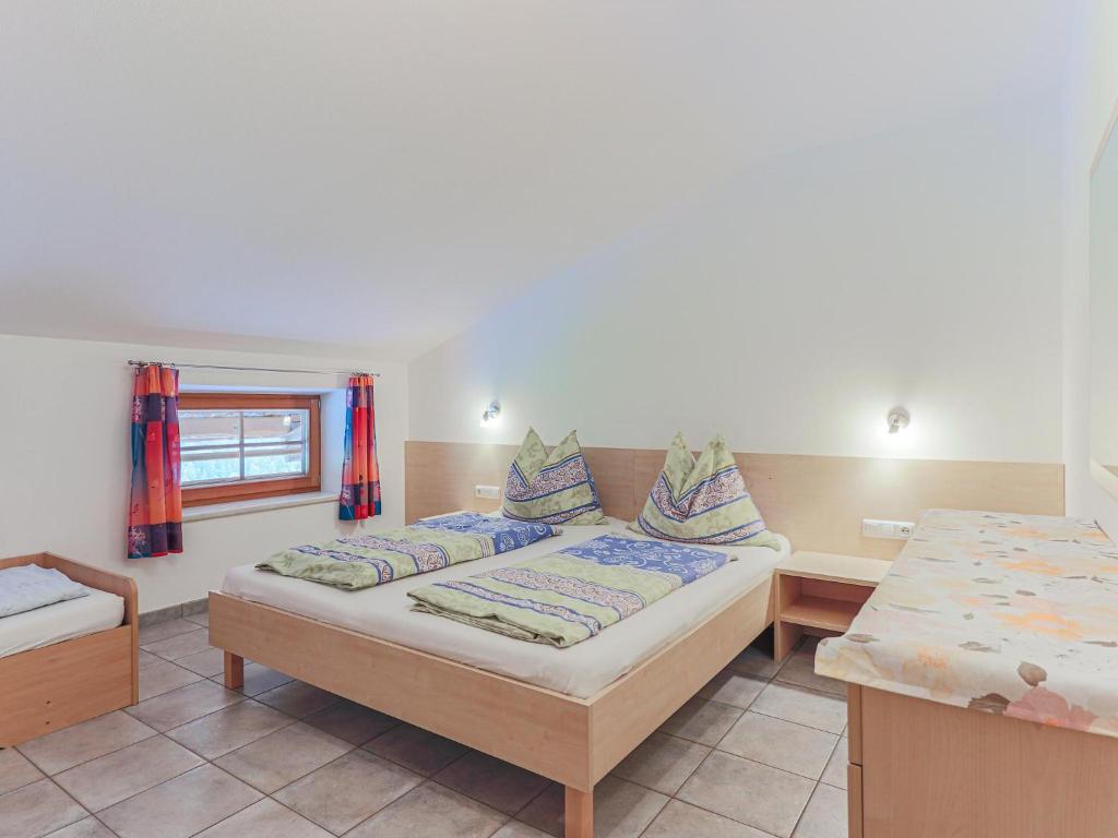 A bed or beds in a room at Koglbauer - Apartment Nr 4