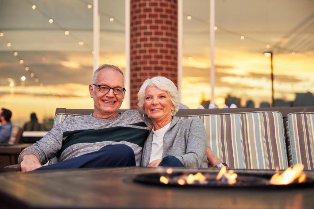 a man and a woman sitting at a table at Hyatt Regency Boston Harbor in Boston
