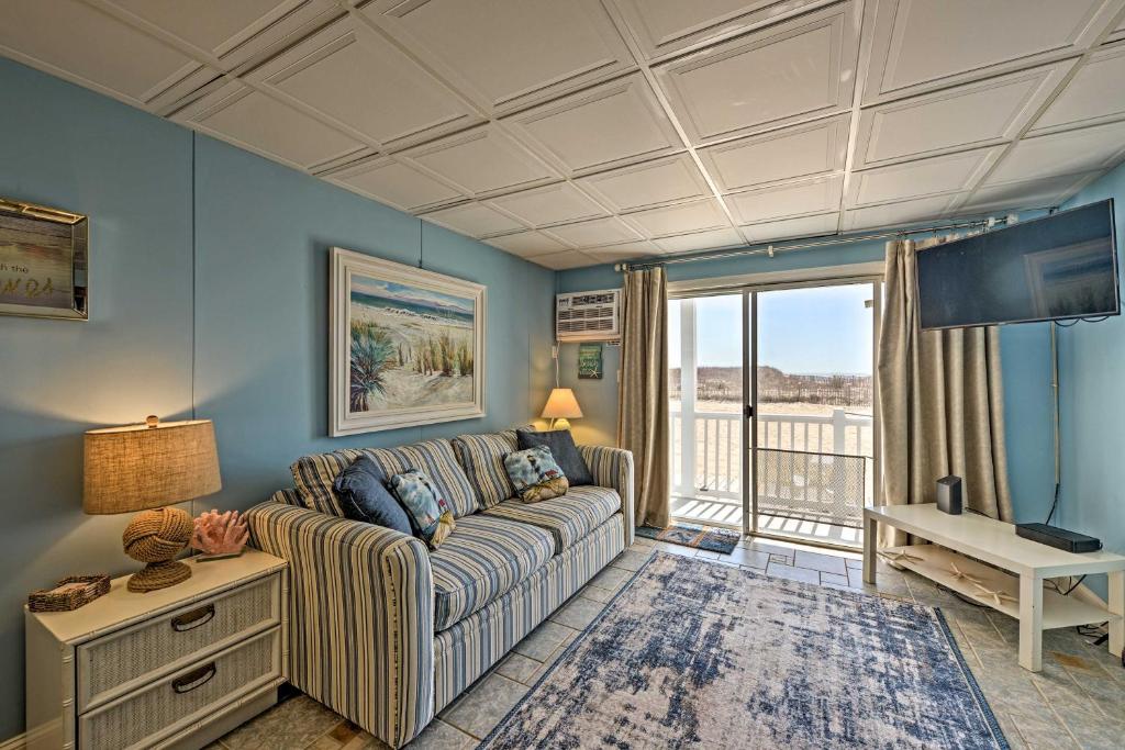 a living room with a couch and a table at Bright Dog-Friendly Escape with Direct Beach Access! in Ocean City
