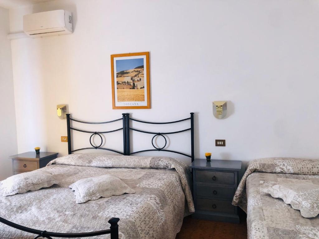 Postel nebo postele na pokoji v ubytování Hotel Marvin