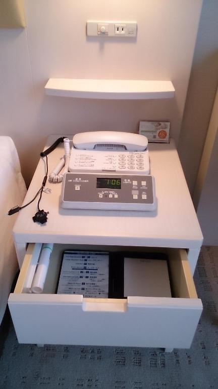 a desk with a scale on top of it at Shibuya Excel Hotel Tokyu in Tokyo