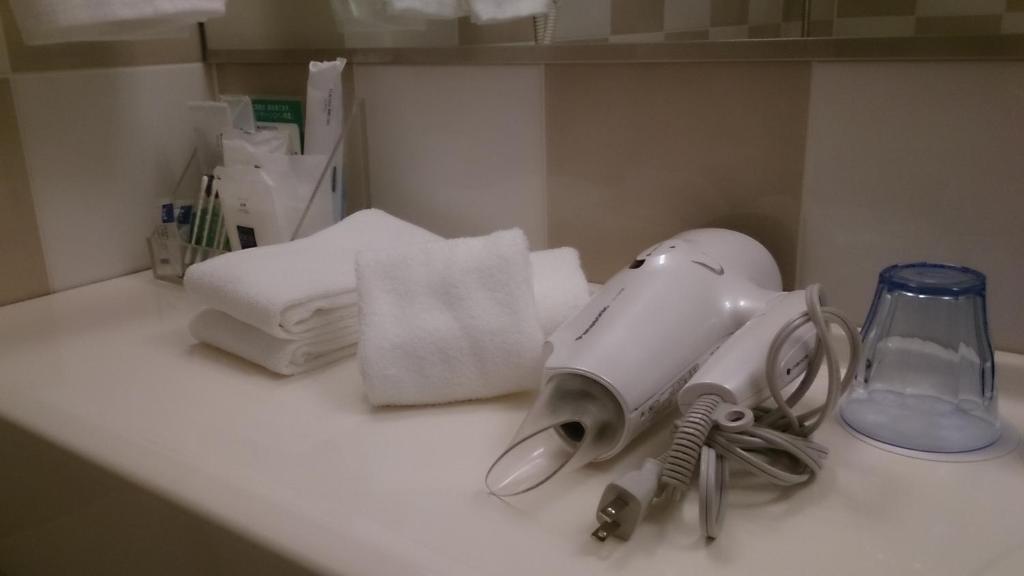 a hair dryer sitting on top of a counter at Shibuya Excel Hotel Tokyu in Tokyo