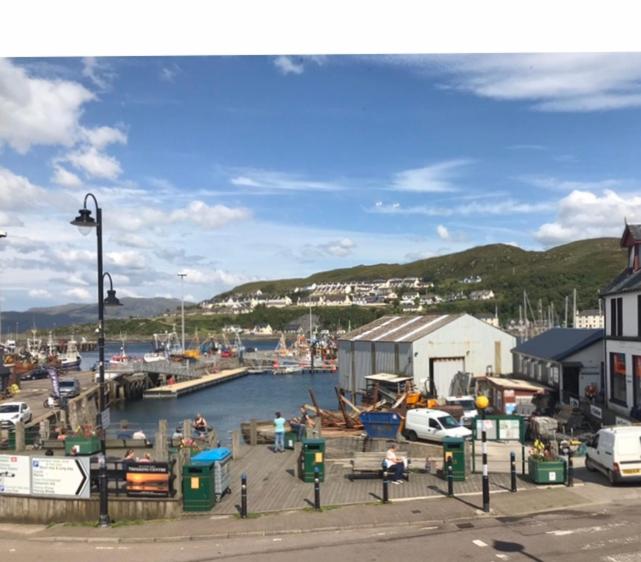 a marina with a bunch of boats in the water at Cornerstone in Mallaig