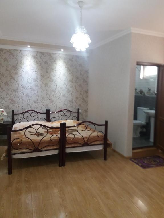 Postel nebo postele na pokoji v ubytování Guest House Darejani