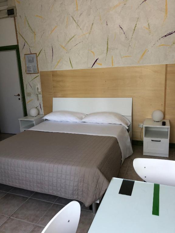 Postel nebo postele na pokoji v ubytování Albergo Moderno