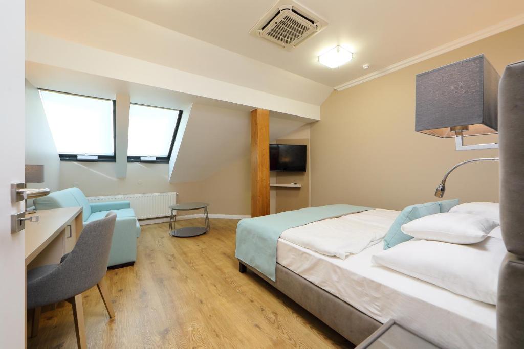 TV a/nebo společenská místnost v ubytování Hotel Blaha Lujza