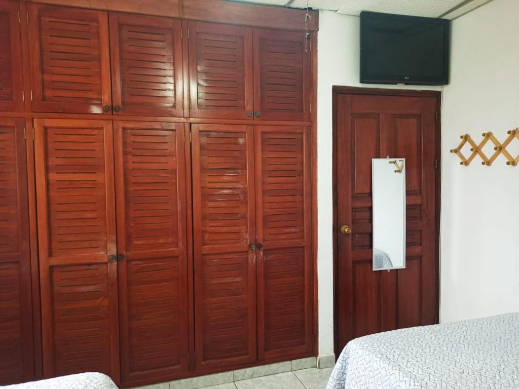A bed or beds in a room at Hostal Familiar Argeñal