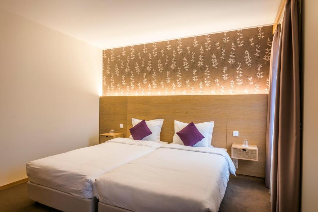 Postel nebo postele na pokoji v ubytování Hotel Bon Repos