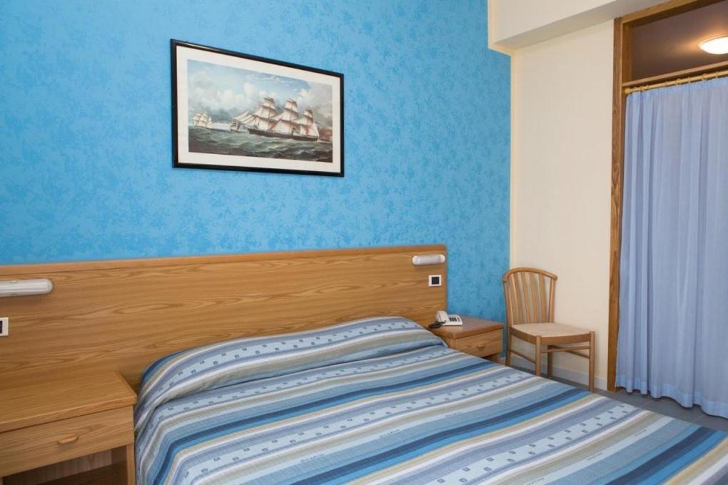 Postel nebo postele na pokoji v ubytování Hotel Parthenius Cirella di Diamante