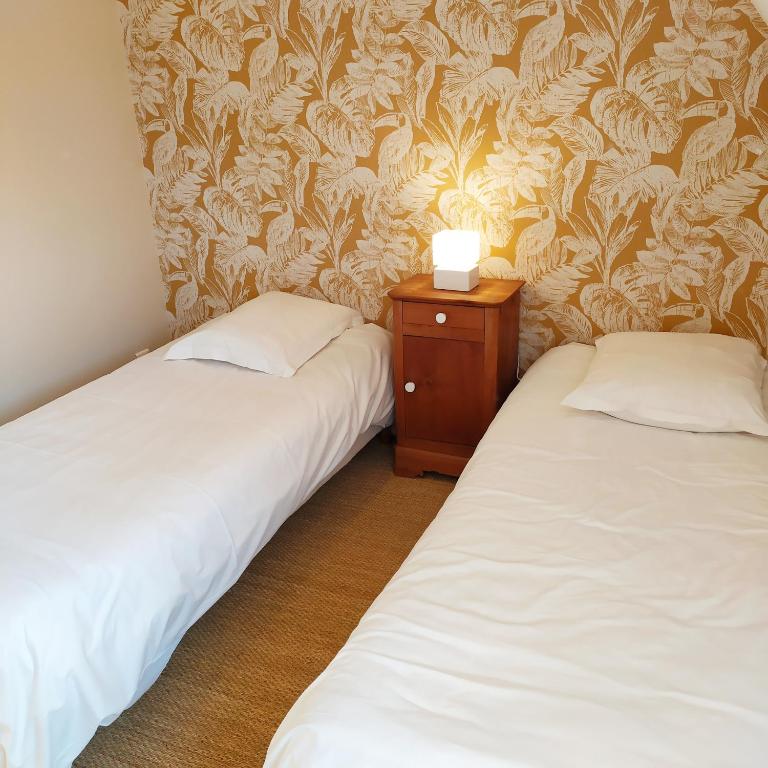 Кровать или кровати в номере Gites et Spa - Manoir des Falaises