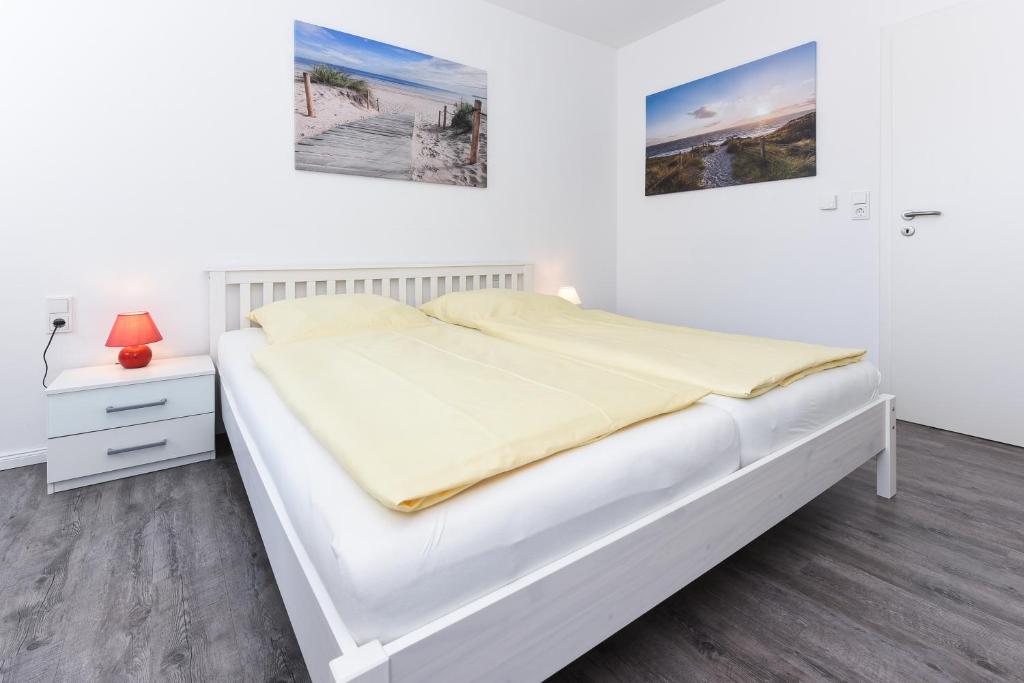 Postel nebo postele na pokoji v ubytování Ferienwohnung Rosalinde
