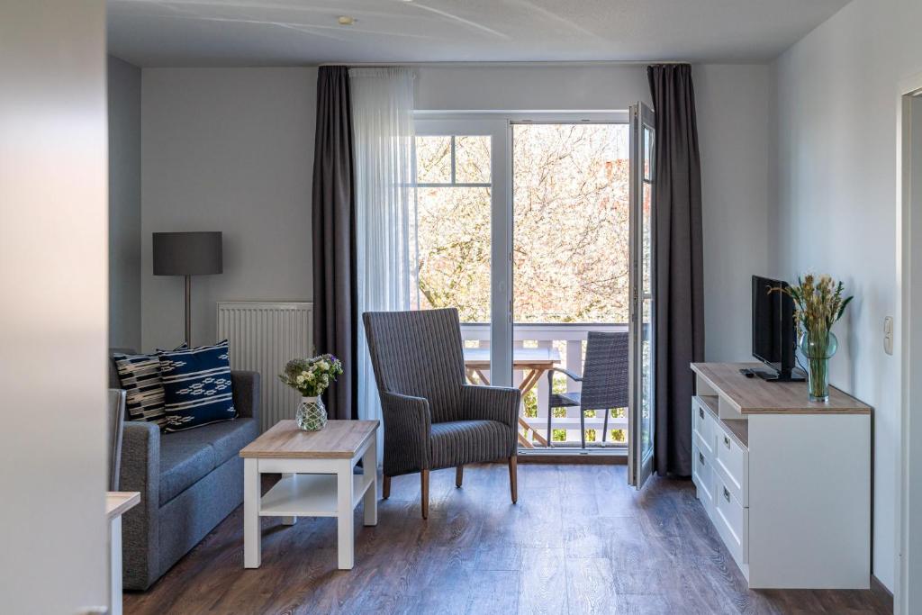 TV a/nebo společenská místnost v ubytování Strandhafer Aparthotel