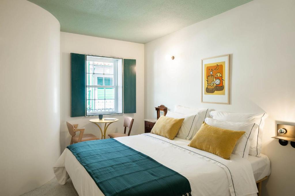 Uma cama ou camas num quarto em Covelo - The Original Rooms and Suites