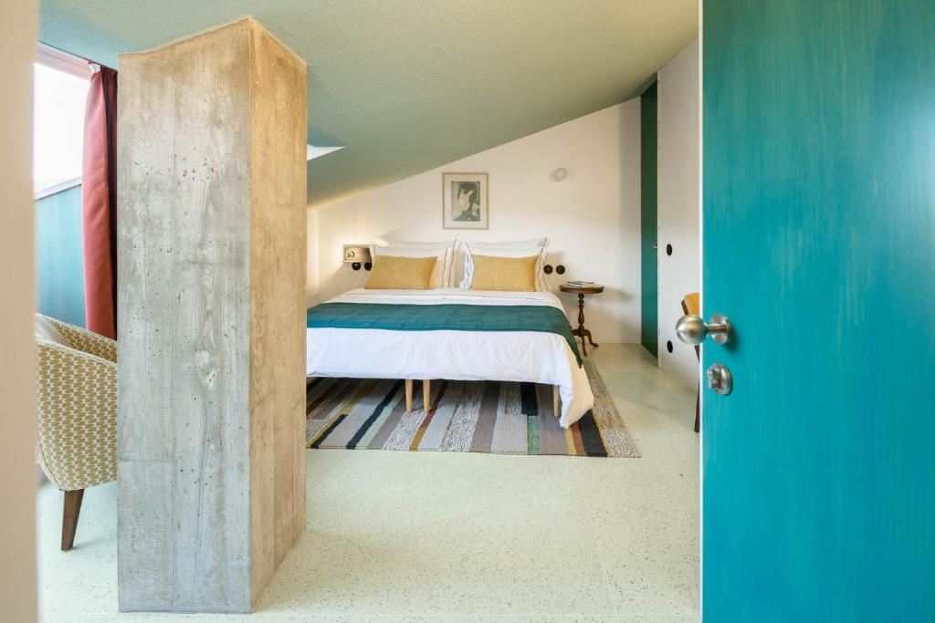 Uma cama ou camas num quarto em Covelo - The Original Rooms and Suites