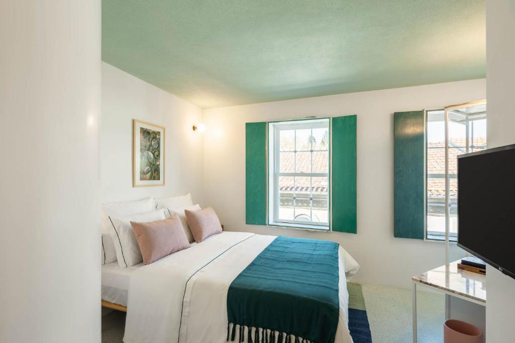 Uma cama ou camas num quarto em Covelo - The Original Rooms and Suites