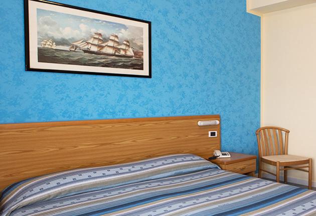 Postel nebo postele na pokoji v ubytování Hotel Parthenius Cirella di Diamante