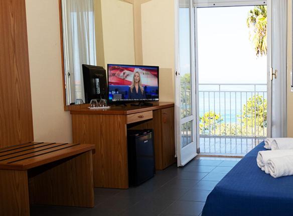 Postel nebo postele na pokoji v ubytování Hotel Parthenius Cirella di Diamante