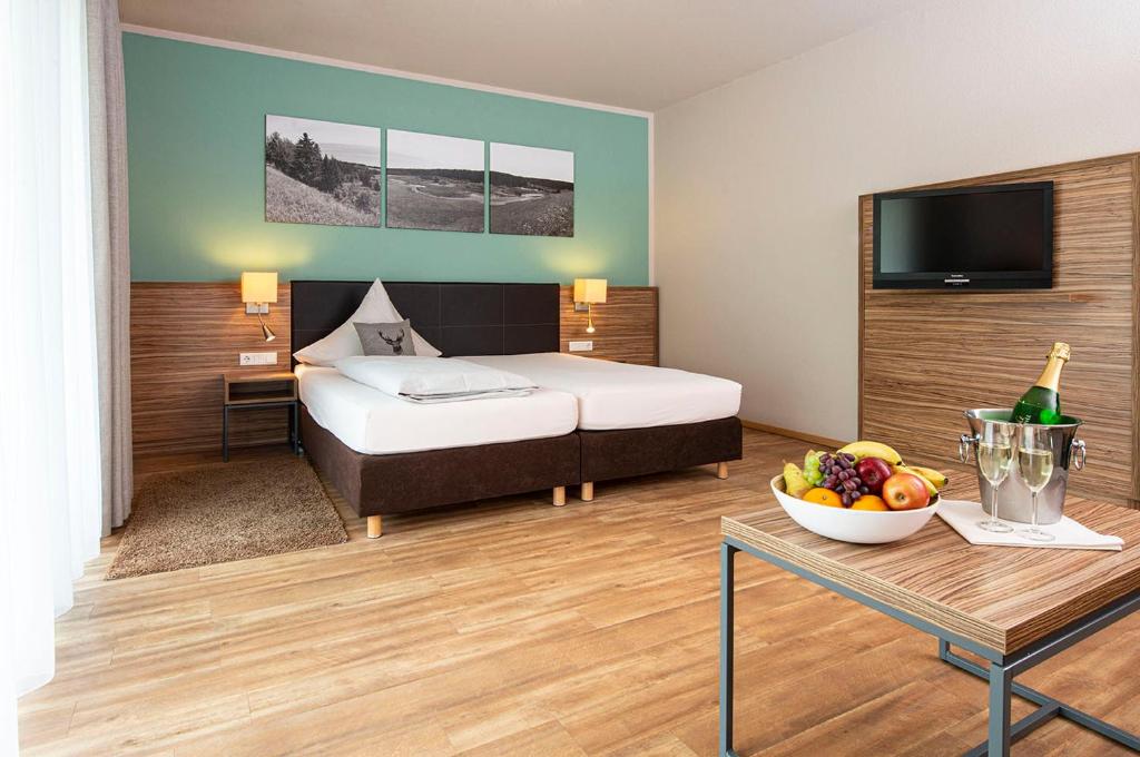 Postel nebo postele na pokoji v ubytování Müller´s Landhotel