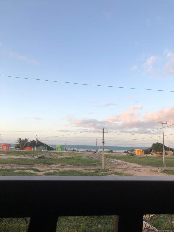 a view of the ocean from a window at Casa na praia com vista para o mar in Luis Correia