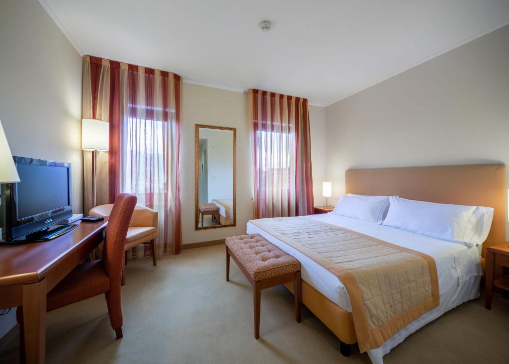 Postel nebo postele na pokoji v ubytování Park Hotel Olimpia