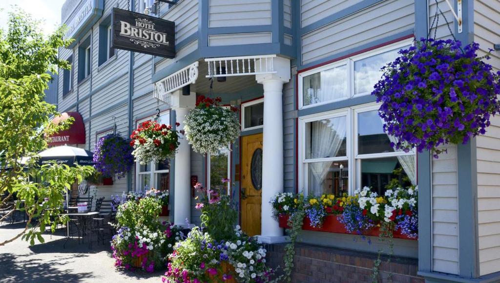 a street scene with flowers in front of a building at The Bristol Hotel in Steamboat Springs