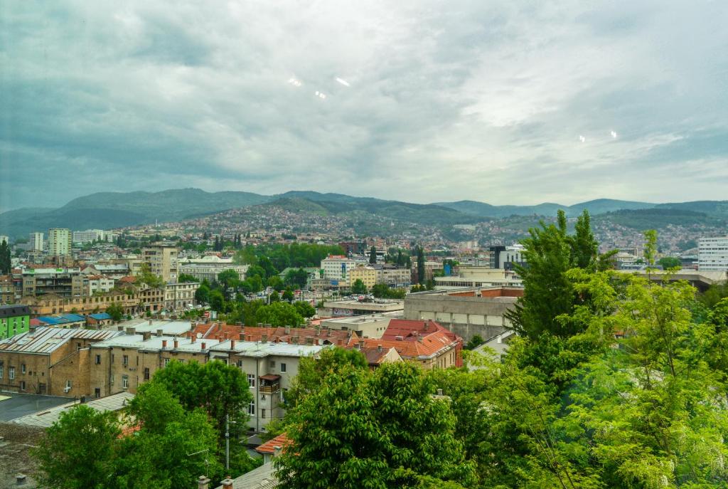 a view of a city with mountains in the background at Panorama Apartment in City-Centre in Sarajevo