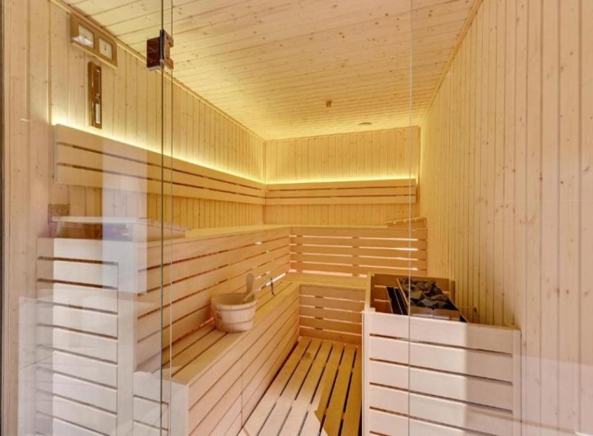 a room with a sauna with a toilet in it at Apartament Dobra Fala in Gdańsk