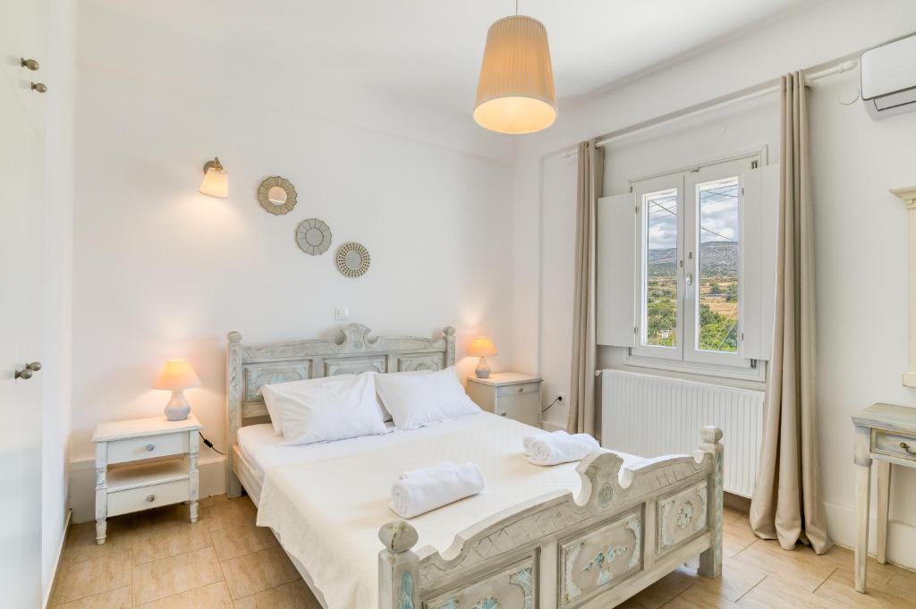 Posteľ alebo postele v izbe v ubytovaní Dahlia Apartments And Studios