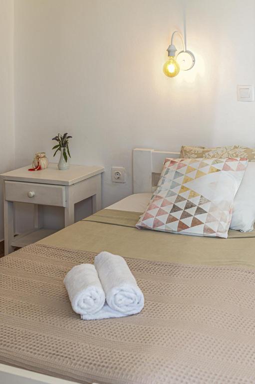 Posteľ alebo postele v izbe v ubytovaní Dahlia Apartments And Studios