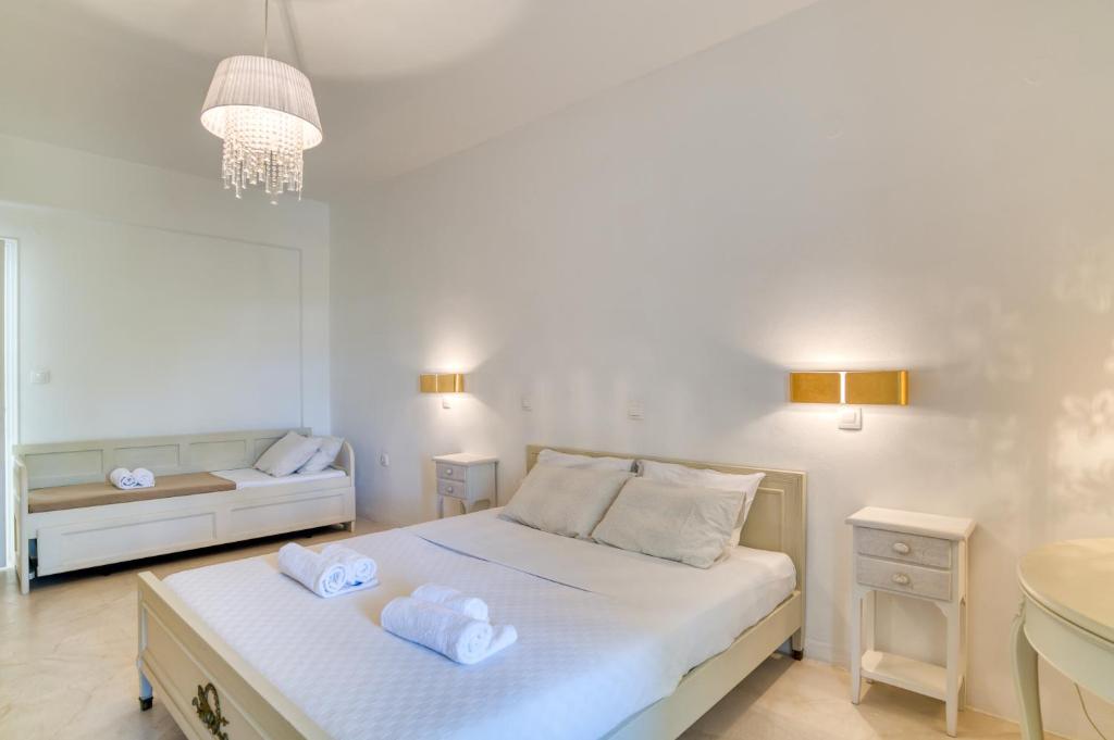 Posteľ alebo postele v izbe v ubytovaní Dahlia Apartments And Studios