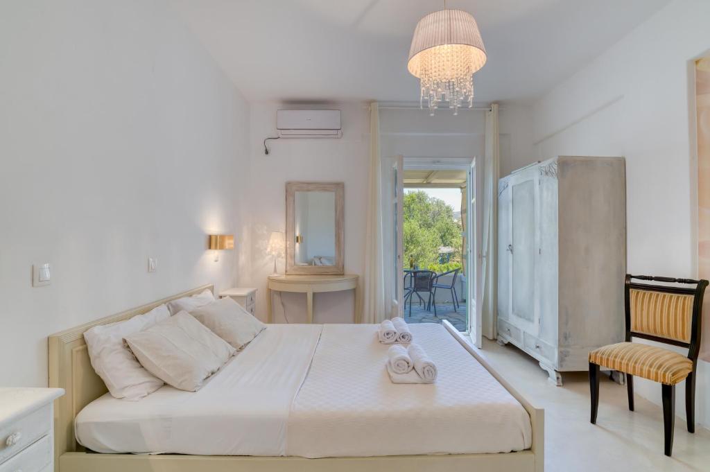 Posteľ alebo postele v izbe v ubytovaní Dahlia Apartments And Studios