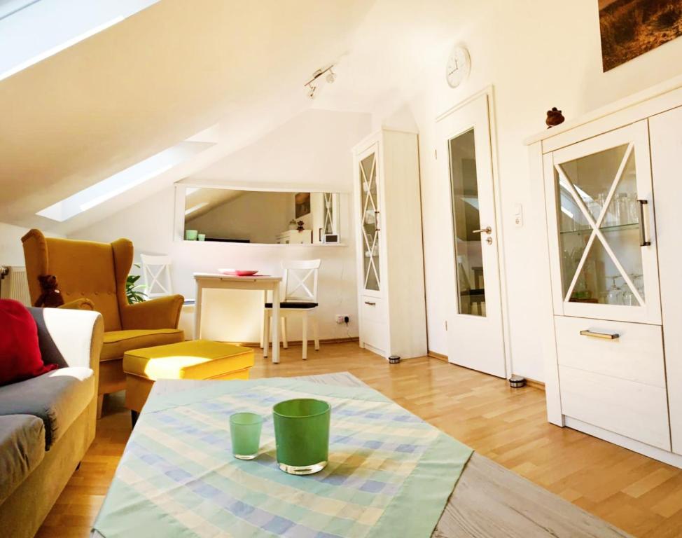 a living room with a couch and a table at Antje's Ferienwohnung Rastede in Rastede