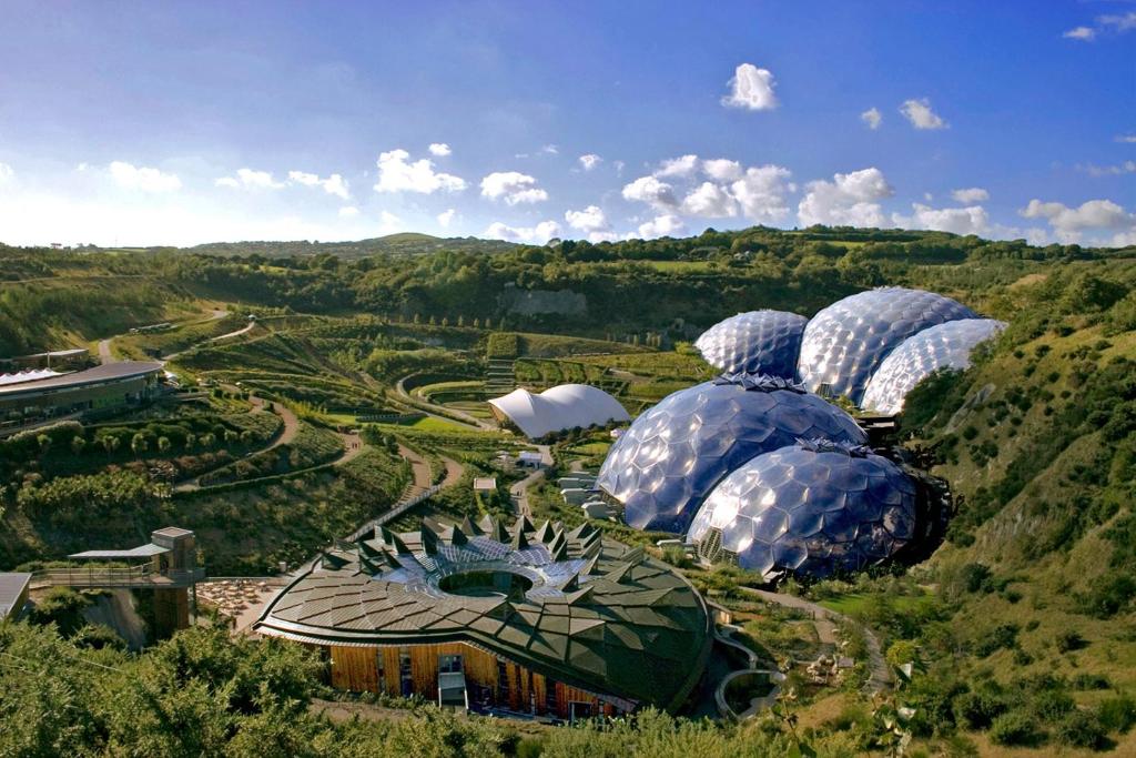 an aerial view of domes of a greenhouse in a field at Shabby Shack near Charlestown & The Eden Project in St Austell