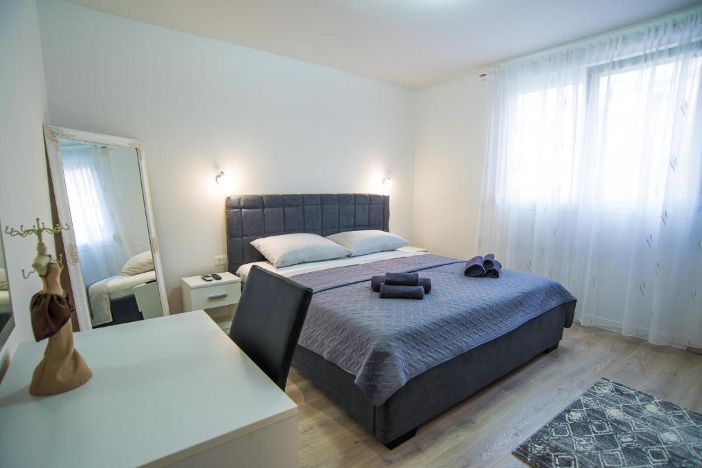 Postel nebo postele na pokoji v ubytování Too Sweet Apartment 1