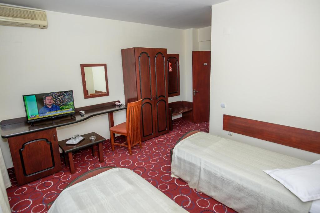 Postel nebo postele na pokoji v ubytování Hotel Scala